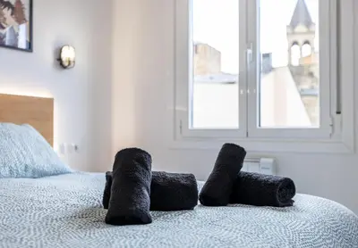 a pair of stuffed animals sitting on a bed at Nômada Castillo _ VUT-LE-251 in Ponferrada