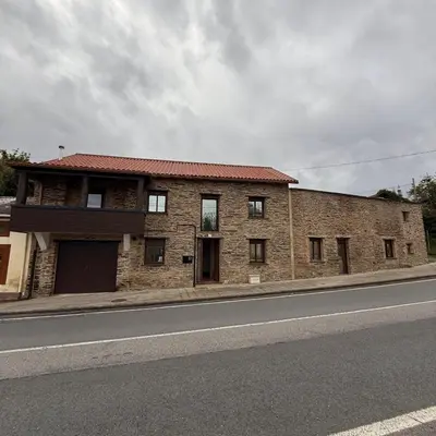 a brick building on the side of a street at A Barreira in Ferrol