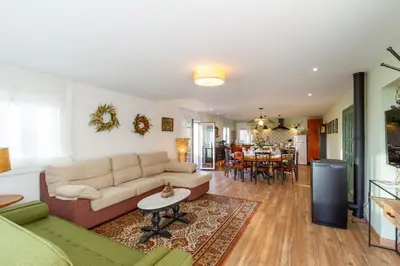 a living room with a couch and a table at A Casa da Carminha, Ribeira Sacra in Pereiro de Aguiar