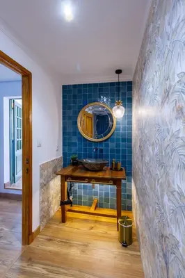 a bathroom with a sink and a mirror on a wall at A Casa da Carminha, Ribeira Sacra in Pereiro de Aguiar