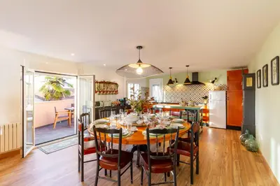 a kitchen and dining room with a table and chairs at A Casa da Carminha, Ribeira Sacra in Pereiro de Aguiar