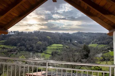 a view of a valley from the balcony of a house at Casa Saborido in Chantada