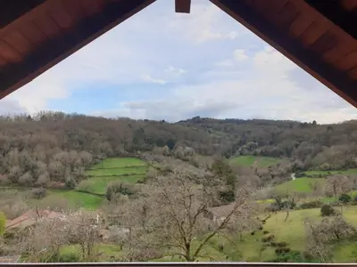 a view of a field from a window at Casa Saborido in Chantada