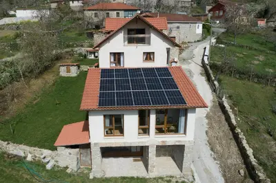 a house with solar panels on its roof at Casa da Cocha in Chantada