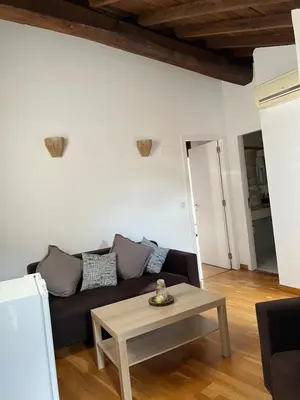 a living room with a couch and a table at Pensión rural Pallabarro in Allariz