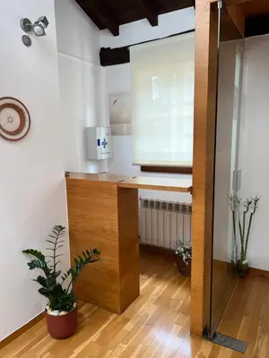a kitchen with a wooden counter and a window at Pensión rural Pallabarro in Allariz