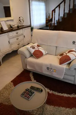 a living room with a couch and a table at O Monteiriño in Arbo