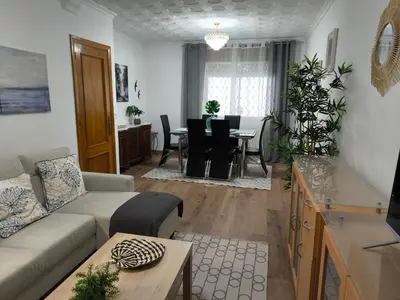 a living room with a couch and a table at Los Hidalgos de Lemos in Monforte de Lemos