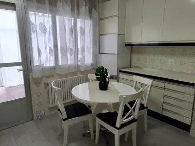 a kitchen with a table and chairs with a plant on it at Los Hidalgos de Lemos in Monforte de Lemos