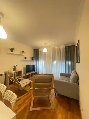 a living room with a couch and chairs at Apartamento con encanto en Cuntis in Cuntis