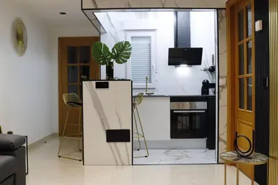 a kitchen with a plant on top of a refrigerator at Apartamento Exclusivo Céntrico con parking Estrella de Ribadeo II in Ribadeo