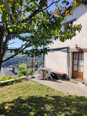 a house with a table and a picnic table outside at Villa Doiras in Boal
