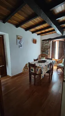 a living room with a table and a couch at Villa Doiras in Boal