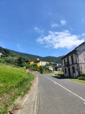 an empty road in a small town with a building at Villa Doiras in Boal