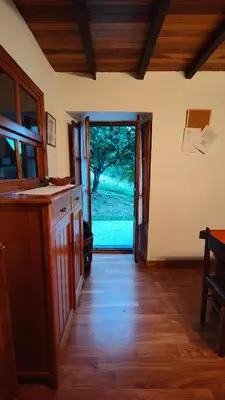 a kitchen with a door open to a yard at Villa Doiras in Boal