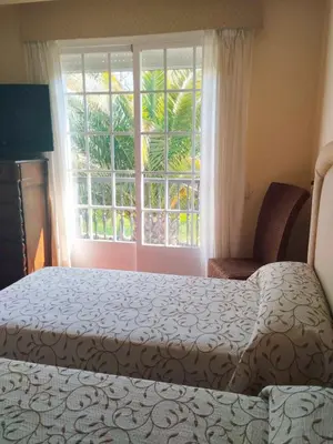 a bedroom with a bed and a large window at Casa Sanmartín in Maside
