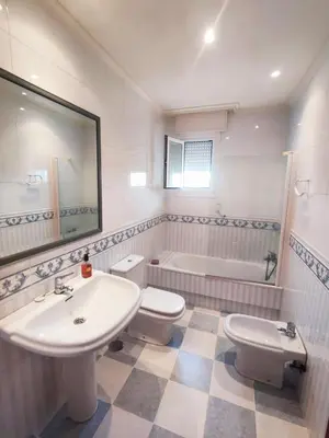 a bathroom with a sink and a toilet and a tub at Casa Sanmartín in Maside