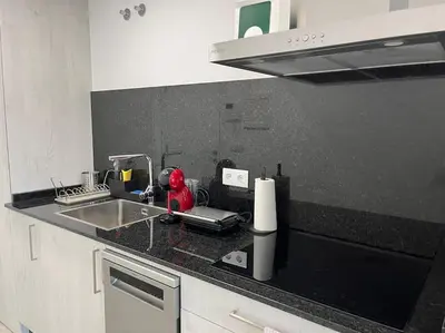 a kitchen with a sink and a counter top at Apartamento céntrico con vistas in Santiago de Compostela