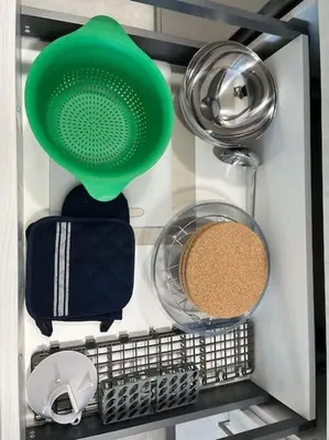 a refrigerator with a green spatula and other kitchen items at Apartamento céntrico con vistas in Santiago de Compostela