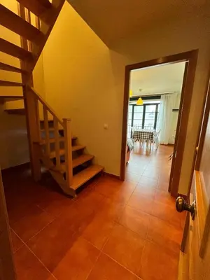 a hallway with a staircase in a house at Orbayu apartamento Foz in Foz