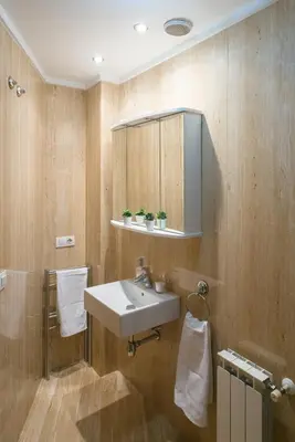a bathroom with a sink and a mirror at Alojamiento Santa Maria in Milladoiro