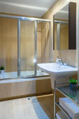 a bathroom with a sink and a shower at Alojamiento Santa Maria in Milladoiro