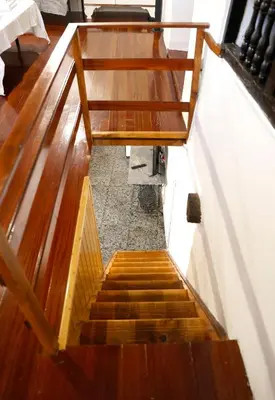 an overhead view of a set of wooden stairs at A casa do pozo - AS CASAS DO POZO - in Folgoso
