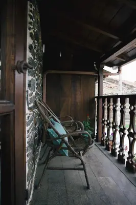 a bathroom with a stone wall with a sink and a mirror at La Casita de Coelho in Doade