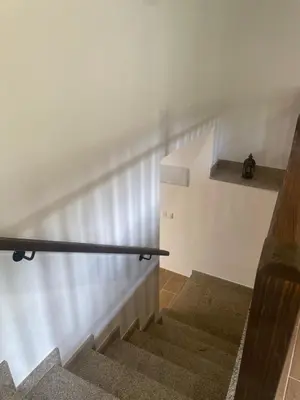 a staircase in a house with a metal railing at Arteleira2 Rooms in Padrón