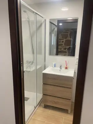 a bathroom with a sink and a shower at Arteleira2 Rooms in Padrón