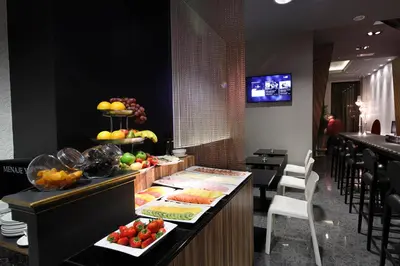 a buffet in a restaurant with fruits and vegetables at Capitol Boutique Hotel in Santiago de Compostela