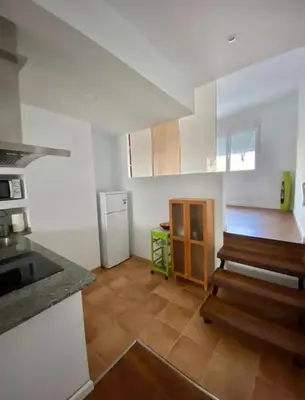 a kitchen with a stove and a refrigerator in it at PRAD in Foz