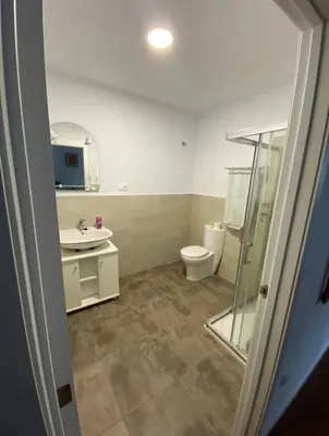 a bathroom with a toilet and a sink at PRAD in Foz