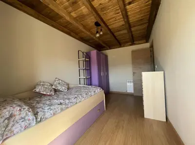 a bedroom with a bed and a dresser and a window at YourHouse A Casa Da Corona casa rural in Parada del Monte