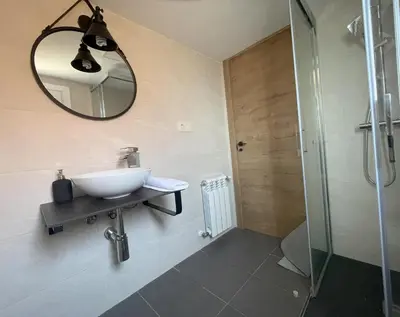 a bathroom with a toilet and a sink and a shower at YourHouse A Casa Da Corona casa rural in Parada del Monte