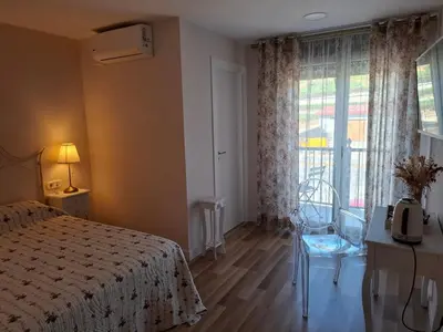 a bedroom with a bed and a window and a chair at Areal in Beade