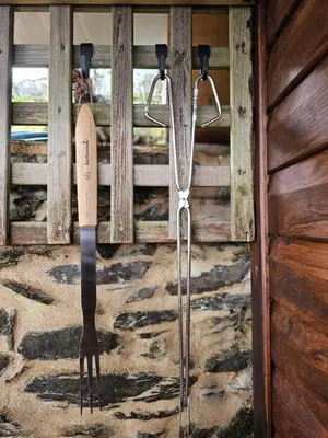 a pair of skis and ski poles hanging on a wall at Viña Candaz By Oktheway in Taboada