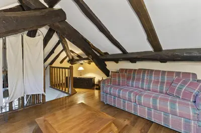 a living room with a couch and a table at Apartamentos rurales Casa Xepo in Rengos