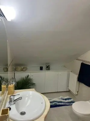 a bathroom with a sink and a toilet at El Pedregal - Playa de Miño in Miño