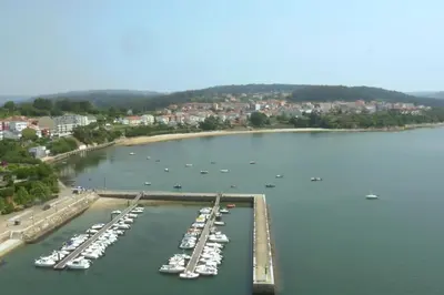 an aerial view of a marina with boats in the water at El Pedregal - Playa de Miño in Miño