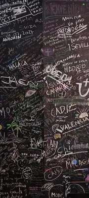 a wall filled with lots of writing on a blackboard at Vivienda Novo Betanzos in Betanzos