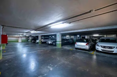 a parking garage with cars parked in it at Apartamento SpítiCasa in Santiago de Compostela