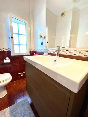 a bathroom with a sink and a toilet at Apartamento Rivela in Burela de Cabo
