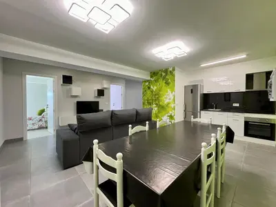 a kitchen and living room with a table and a couch at Romero AP in Santiago de Compostela