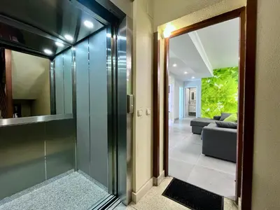 a hallway with a glass door leading to a living room at Romero AP in Santiago de Compostela
