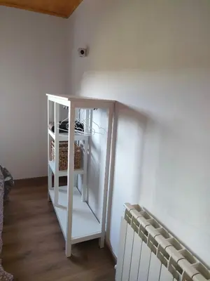 a white cabinet in a room with a wall at Casa Telmo in Acova