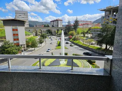 a view from a balcony of a city with a fountain at Pirámides Ourense in Ourense