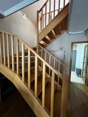 a staircase in a house with wooden floors at Duplex Playa de Foz in Foz