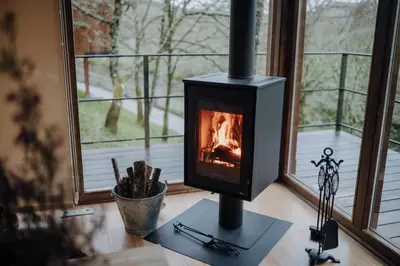a stove sitting on a table in front of a window at Casal Oseira in Ourense