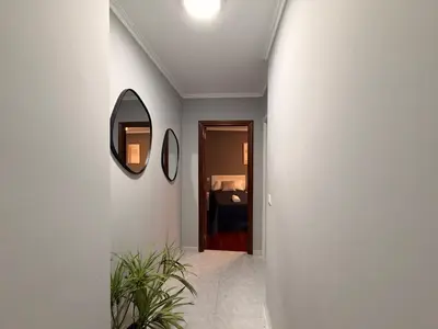 a mirror and a wooden table in a room at O Loureiro - Grupo Arcanos in Caldas de Reis